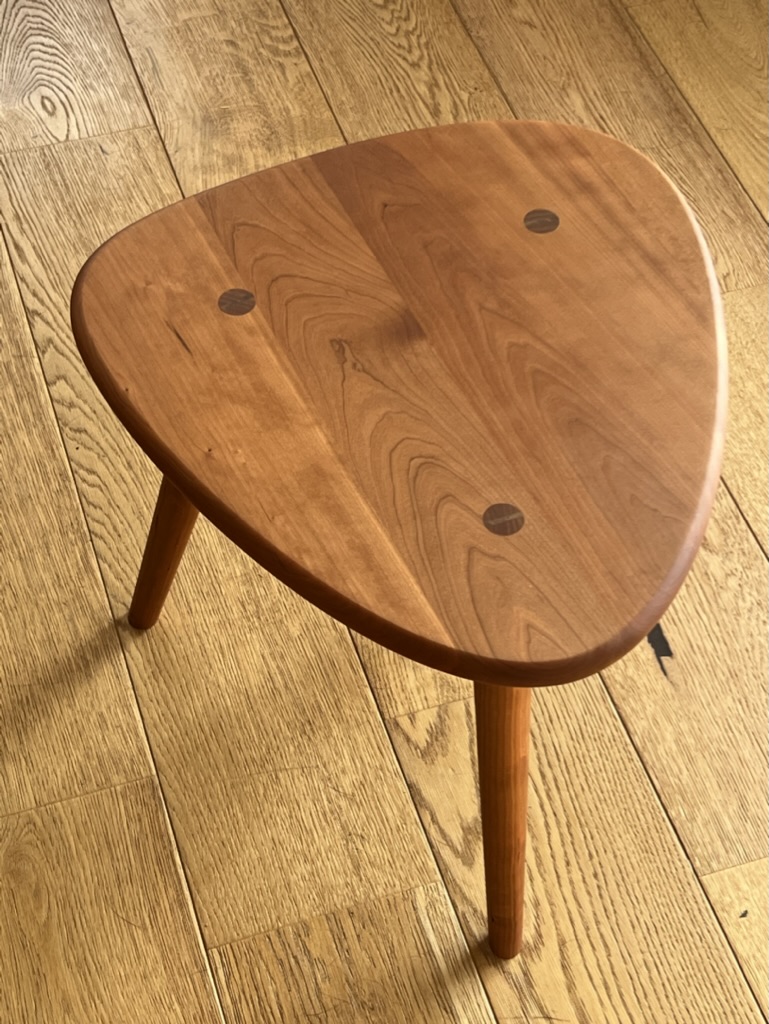 Bespoke cherry three-legged side table with walnut dowel inlay, handmade by Mark Eden Design