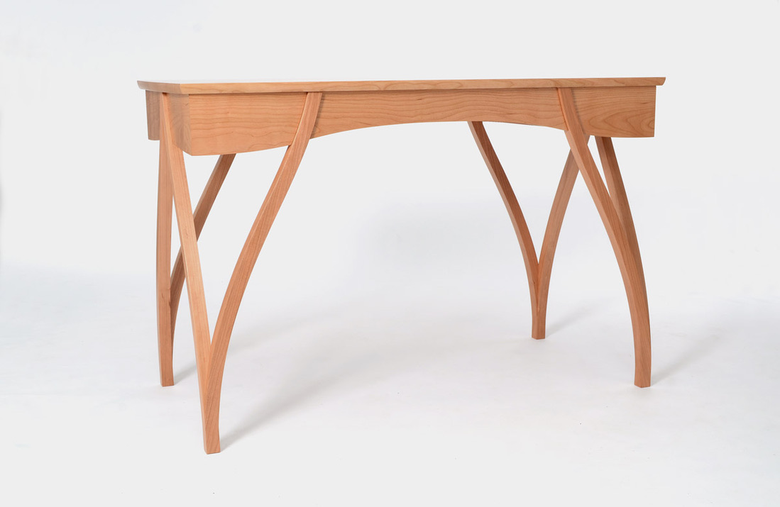 Bespoke cherry writing desk with crossed arched legs, full side view, handmade by Mark Eden Design